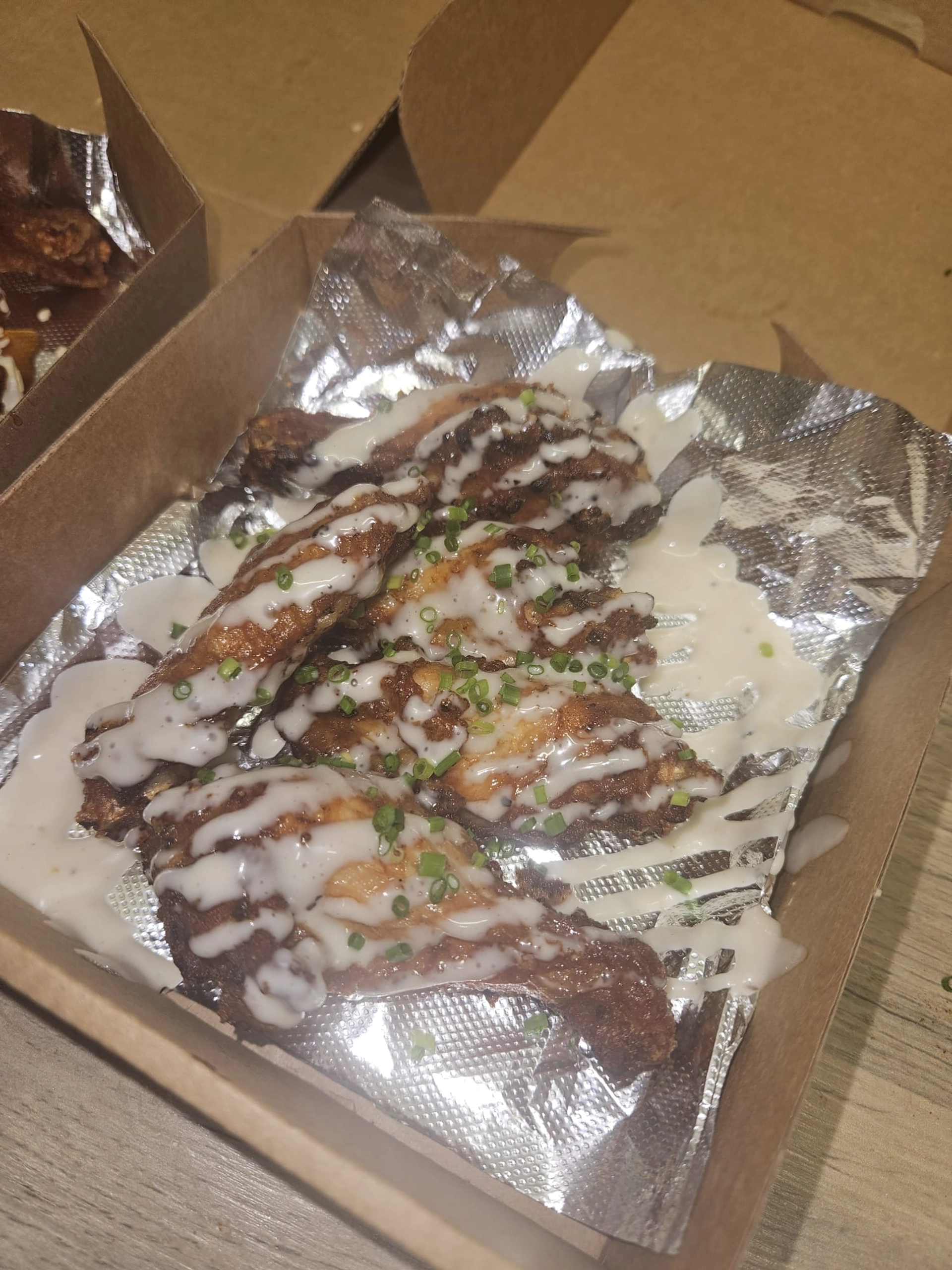 Blue cheese chicken wings topped with chives